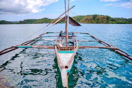 Fishing boat at the shore waiting for the  day.の素材 [FY310126194530]