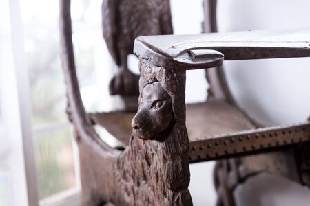 Old decorative chair with its intricate wood curving.の写真素材