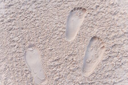Footprints at the powdery white sand of Boracay, Philippines.