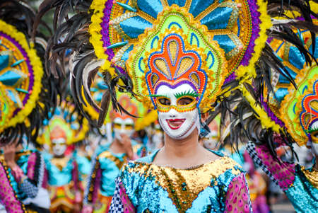 Colorful masks of street dacnce parade performer during Masskara Festival at Bacolod City, Philippines.のeditorial素材