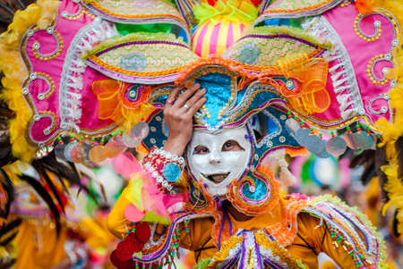 Colorful masks of street dacnce parade performer during Masskara Festival at Bacolod City, Philippines.のeditorial素材