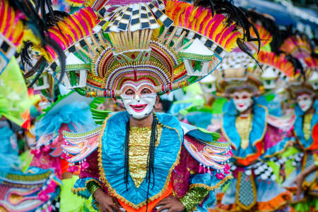 Colorful masks of street dacnce parade performer during Masskara Festival at Bacolod City, Philippines.のeditorial素材