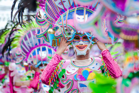 Colorful masks of street dacnce parade performer during Masskara Festival at Bacolod City, Philippines.のeditorial素材