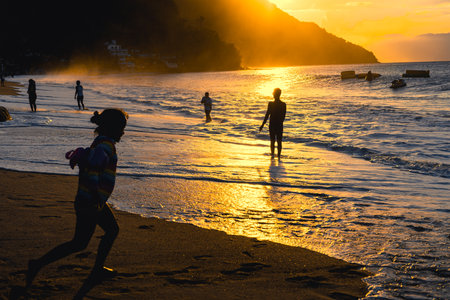 Enjoying summer at the beach of Puerto Galera, Philippines at sunset.の写真素材