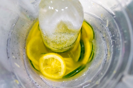 Healthy iced lemonade with cucumber in a glass.の写真素材