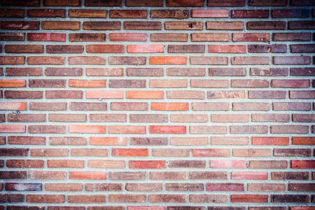 Weathered texture of stained old dark brown and red brick wall background, grungy rusty blocks of...