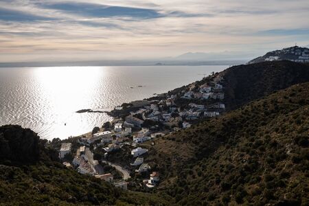 Sunrise over Mediterranean coast town shot from high ground in Costa Brava, Catalonia (SPAIN)
