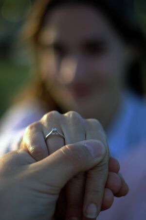 Blurred women portrait showing her engagement ringの写真素材