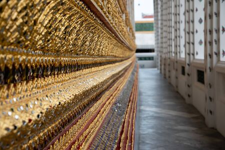 Close up of the golden details of a Thai Templeの写真素材
