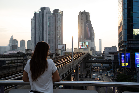 November 19th, 2018 - Bangkok (THAILAND) - Woman on train station in Bangkok during sunsetのeditorial素材