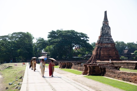 November 21th, 2018 - Ayutthaya (THAILAND) - Women with traditional dress visiting at thai temple ruinsのeditorial素材