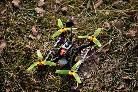 Above view of a static drone in the grass before flying