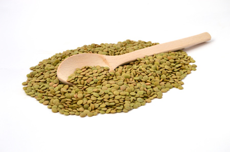 wooden spoon and lentilsの写真素材