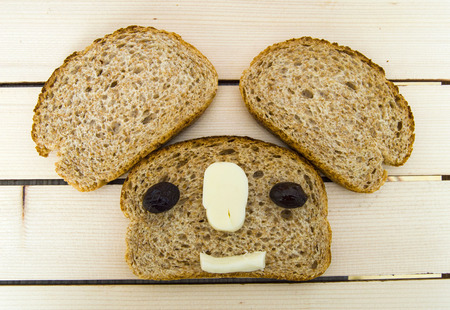 Bran besides bread and black olives, cheese, cheese and black olives. the most beautiful breakfast of different concepts bread, olive and cheese pictures,の写真素材