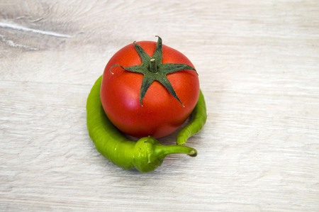 Tomato-wrapped green pepper, pepper and tomato friendshipの写真素材