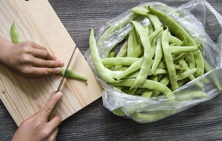 Fresh green beans ready to eat, green bean with knife,