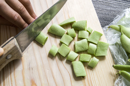 Fresh green beans ready to eat, green bean with knife,