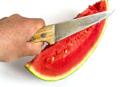 Cut a slice of watermelonの写真素材