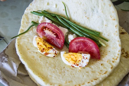 To make hamburger among turkish bread, to make cheese hamburger with fresh doner breadの写真素材