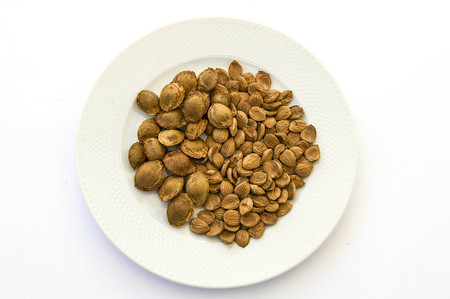 nuts in sweet apricot kernels plate