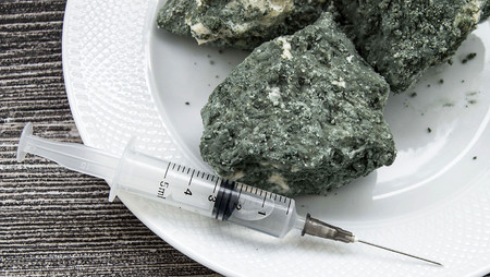 raw material of syringe and penicillin microbe on white ground moldy cheeseの写真素材
