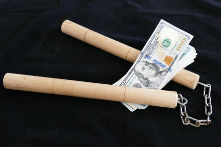 make kung fu fight with nunchaku for american dollars,の写真素材