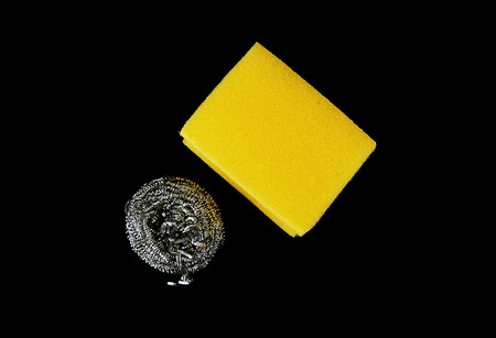 close up of dish sponge and dish wire black back ground,の写真素材