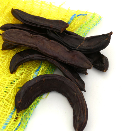 carob on a plate on a white backgroundの写真素材