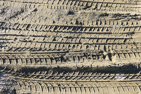 car tire tracks on the mud