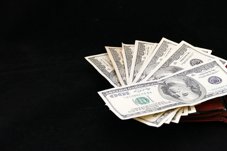 dollar bills on black backgroundの写真素材