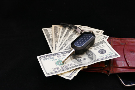 rich businessman, mobile phone, wallet, dollar and car key,の写真素材