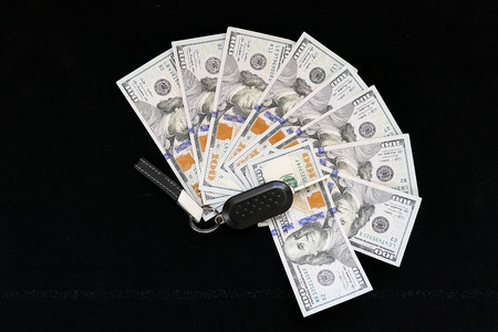 One hundred dollars and next to the car keyの写真素材