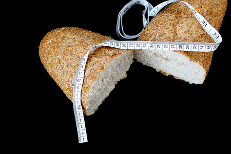 wholemeal bread and tape measureの写真素材