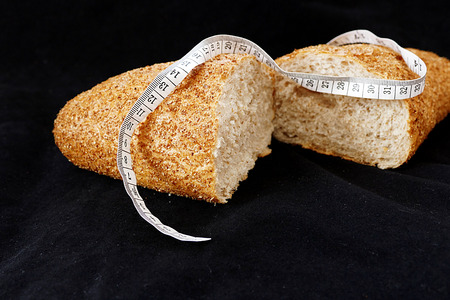 wholemeal bread and tape measureの写真素材