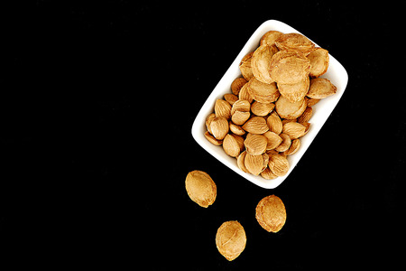 dried apricot kernels in a plate,