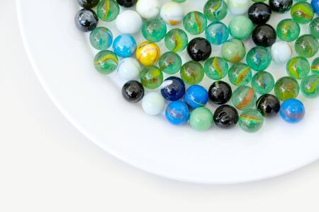 fun game for kids with colored glass marbles, glass balls,の写真素材