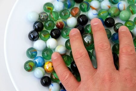 fun game for kids with colored glass marbles, glass balls,