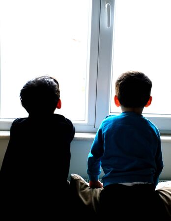 Children who are forbidden to go out due to Corona virus,stay home and Covid-19,の写真素材