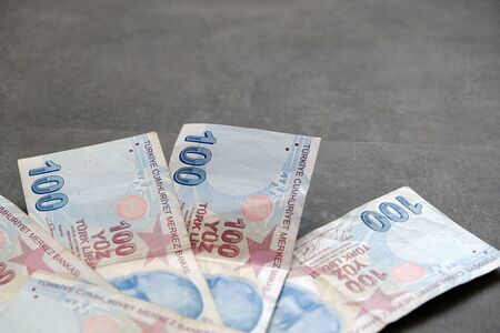 100 turkish lira, standing on the black groundの写真素材