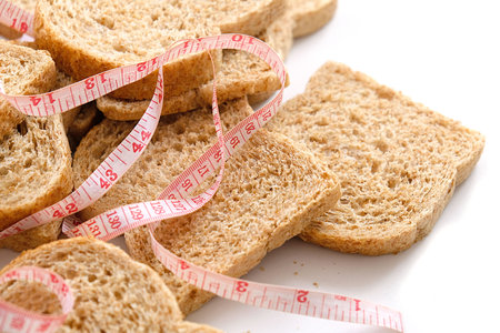 slices of bran bread with a tape measure, ideal bran bread for weight loss,の写真素材