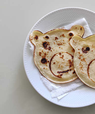 scrambled egg pancakes with bear figures, baked figured pancakes for children,の写真素材