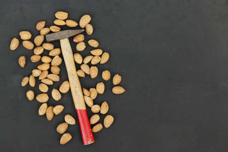 break dry shelled almonds with hammer. hammer and dry almonds,の写真素材