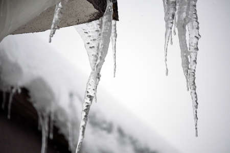 icicles on the roof, it's snowing, it's a hard winter,