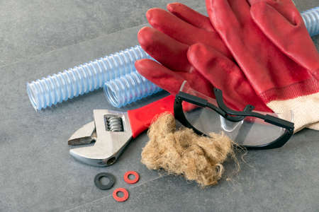 serrated kitchen drain pipe and wrench,plumbing linen and thick work gloves-plumbing works-plumbing...