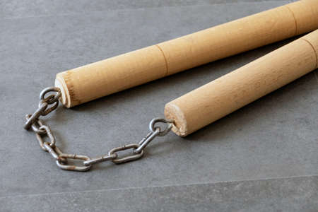 nunchaku, one of the close-up martial arts of the far east- nunchaku, made of handmade wood and chain,の写真素材