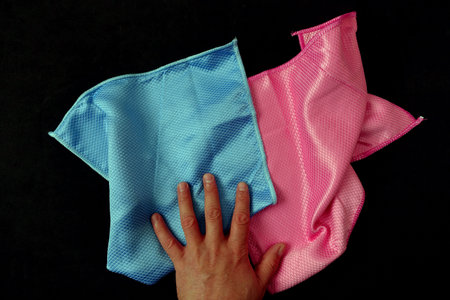 microfiber cleaning cloths on a black background,