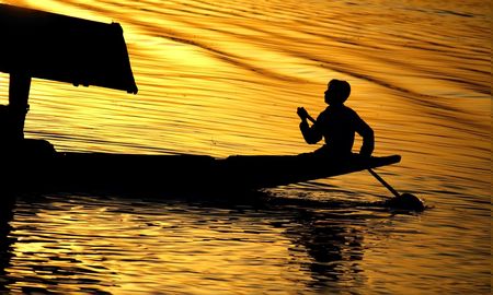 shikara on dal lake during sunsetの写真素材