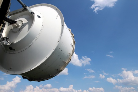 white telecommunication dish under cloudy skyの写真素材