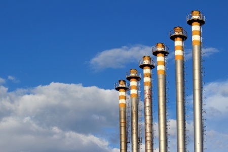 group of same old chimney under skyの写真素材