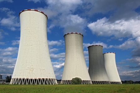 four coal power plant cooling tower under dramatic skyのeditorial素材
